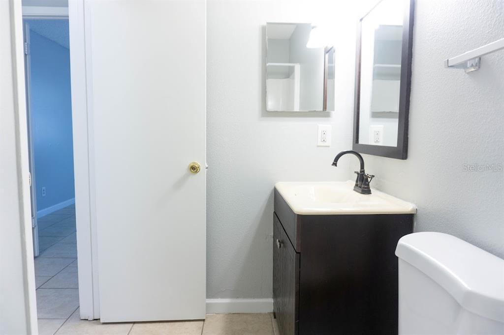 237 Thorntree Place, Unit 237 Brandon, FL 33510 - Photo 31 of 55 a bathroom with a sink toilet and mirror