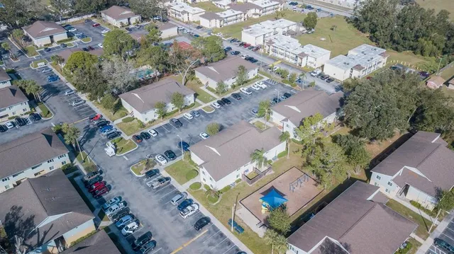 an aerial view of multiple houses with outdoor space