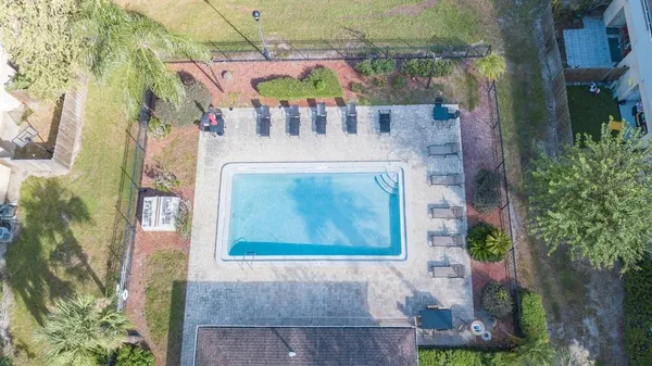 an aerial view of multiple houses with outdoor space