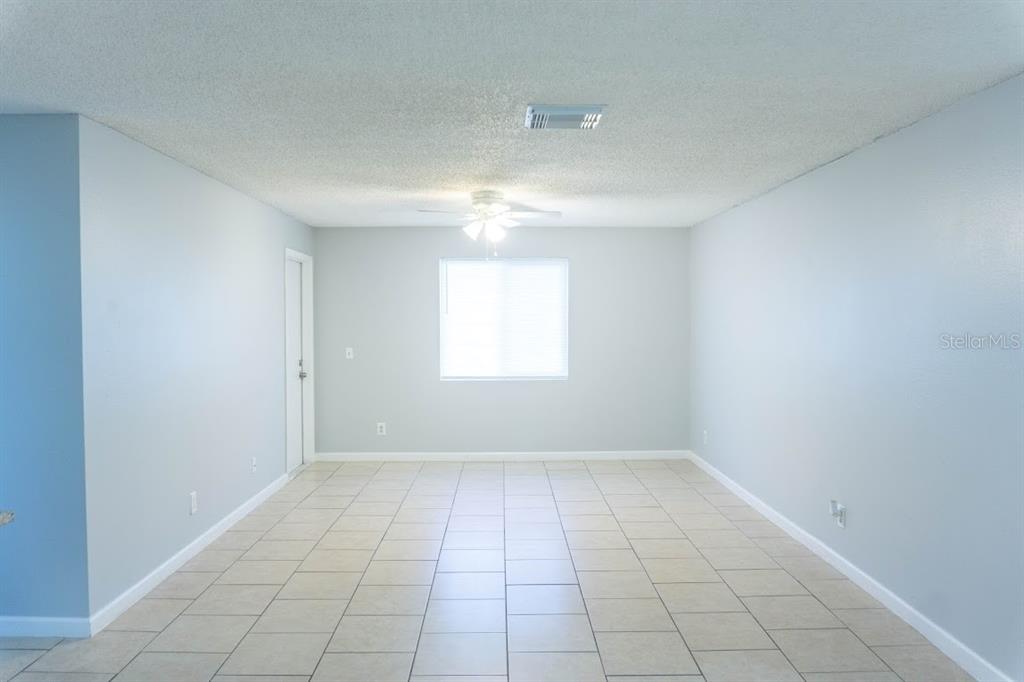 237 Thorntree Place, Unit 237 Brandon, FL 33510 - Photo 6 of 58 wooden floor in an empty room with a window