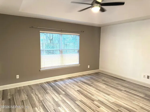 a view of an empty room with a window