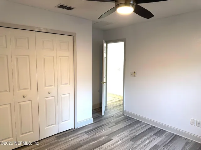 a bathroom with a granite countertop sink toilet a bathtub and shower