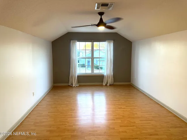 a view of an entryway with a floor to ceiling window