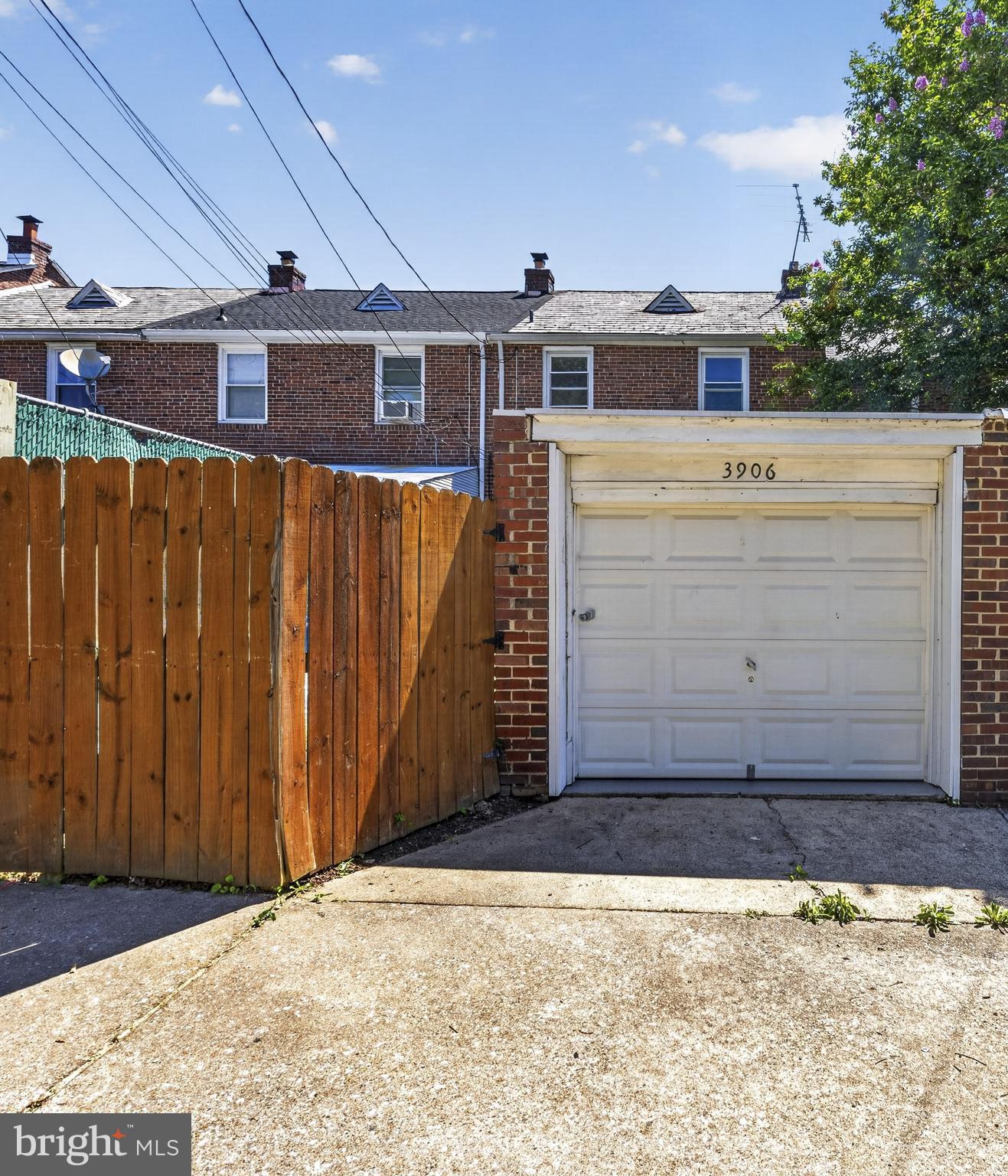 3906 Yolando Road Baltimore, MD 21218 - Photo 29 of 30 a view of a house with a wooden fence
