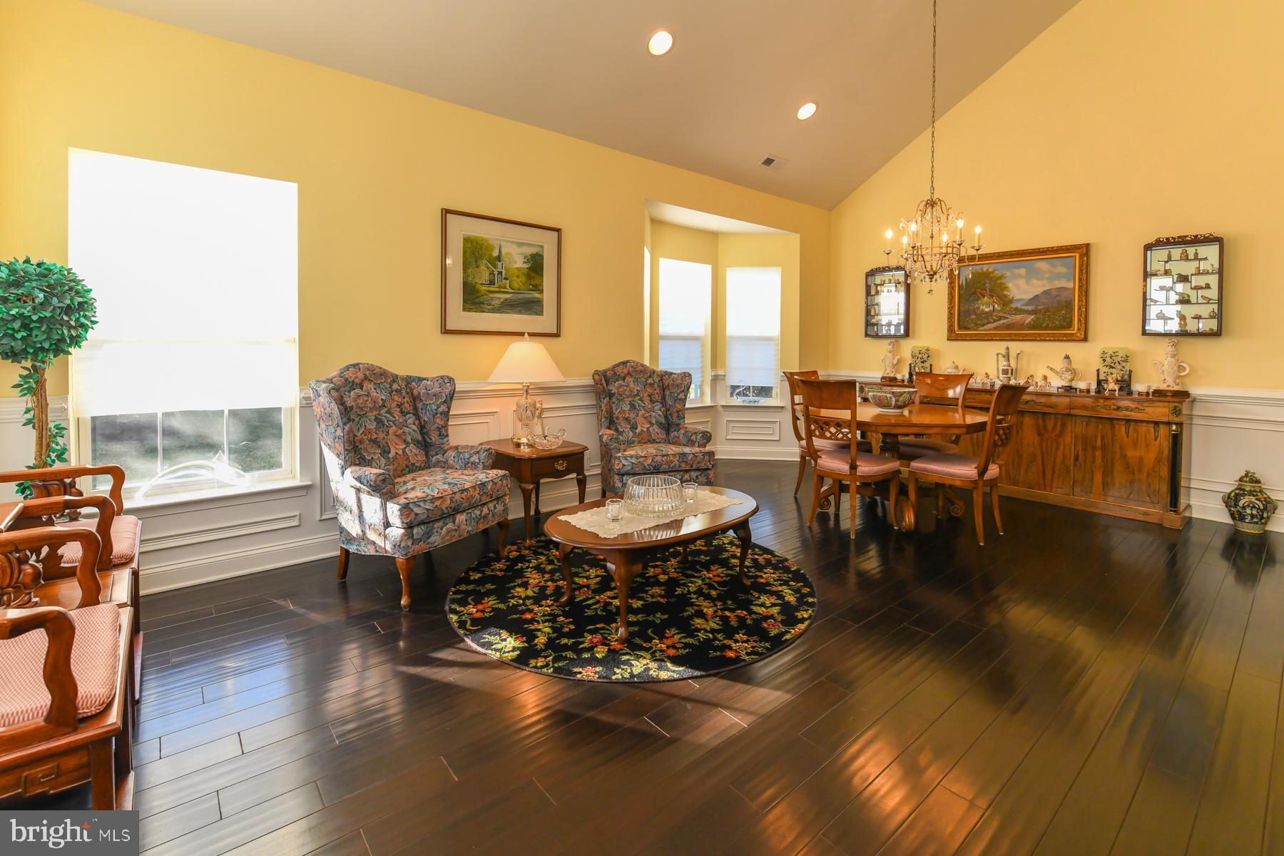 111 Weatherby Lane Glassboro, NJ 08028 - Photo 14 of 95 a living room with couches chairs and a coffee table with wooden floor