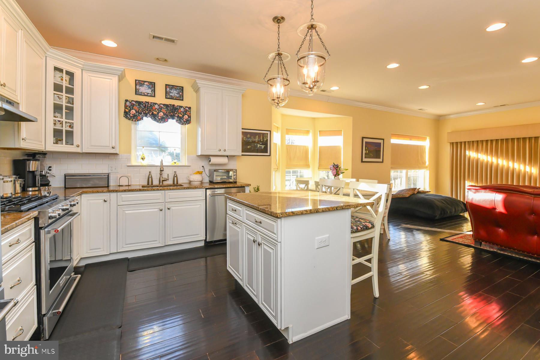 111 Weatherby Lane Glassboro, NJ 08028 - Photo 26 of 95 a kitchen with a sink stove cabinets and wooden floor