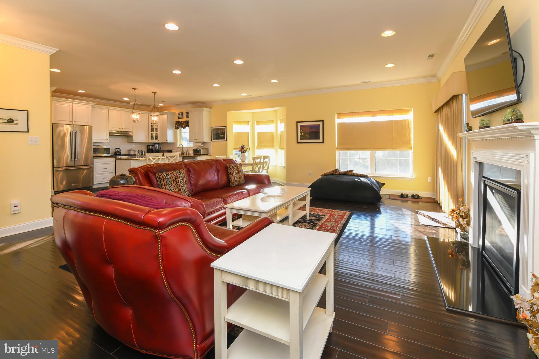 111 Weatherby Lane Glassboro, NJ 08028 - Photo 29 of 95 a living room with furniture a fireplace and wooden floor