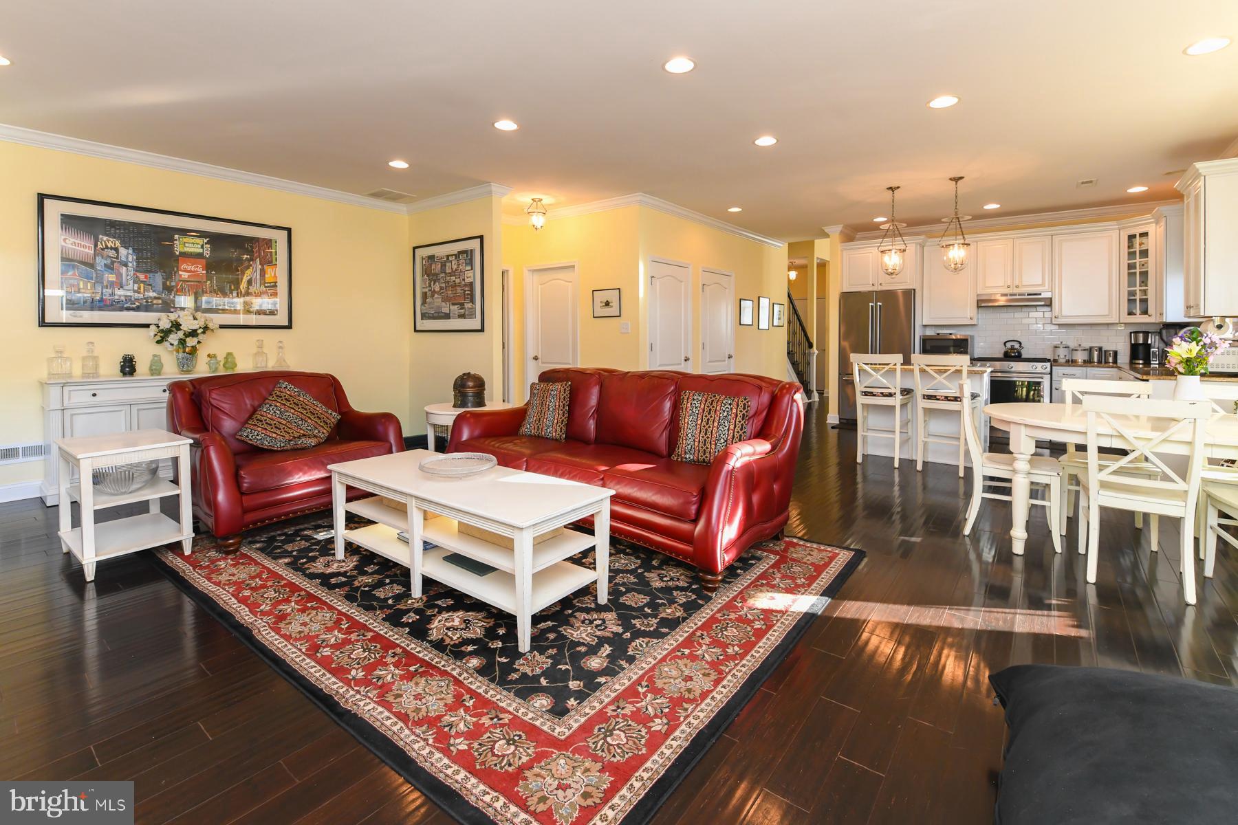 111 Weatherby Lane Glassboro, NJ 08028 - Photo 31 of 95 a living room with furniture a rug and kitchen view