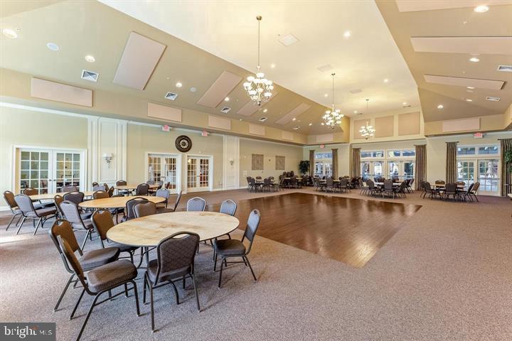 111 Weatherby Lane Glassboro, NJ 08028 - Photo 83 of 95 a large dining space with lots of furniture and a chandelier