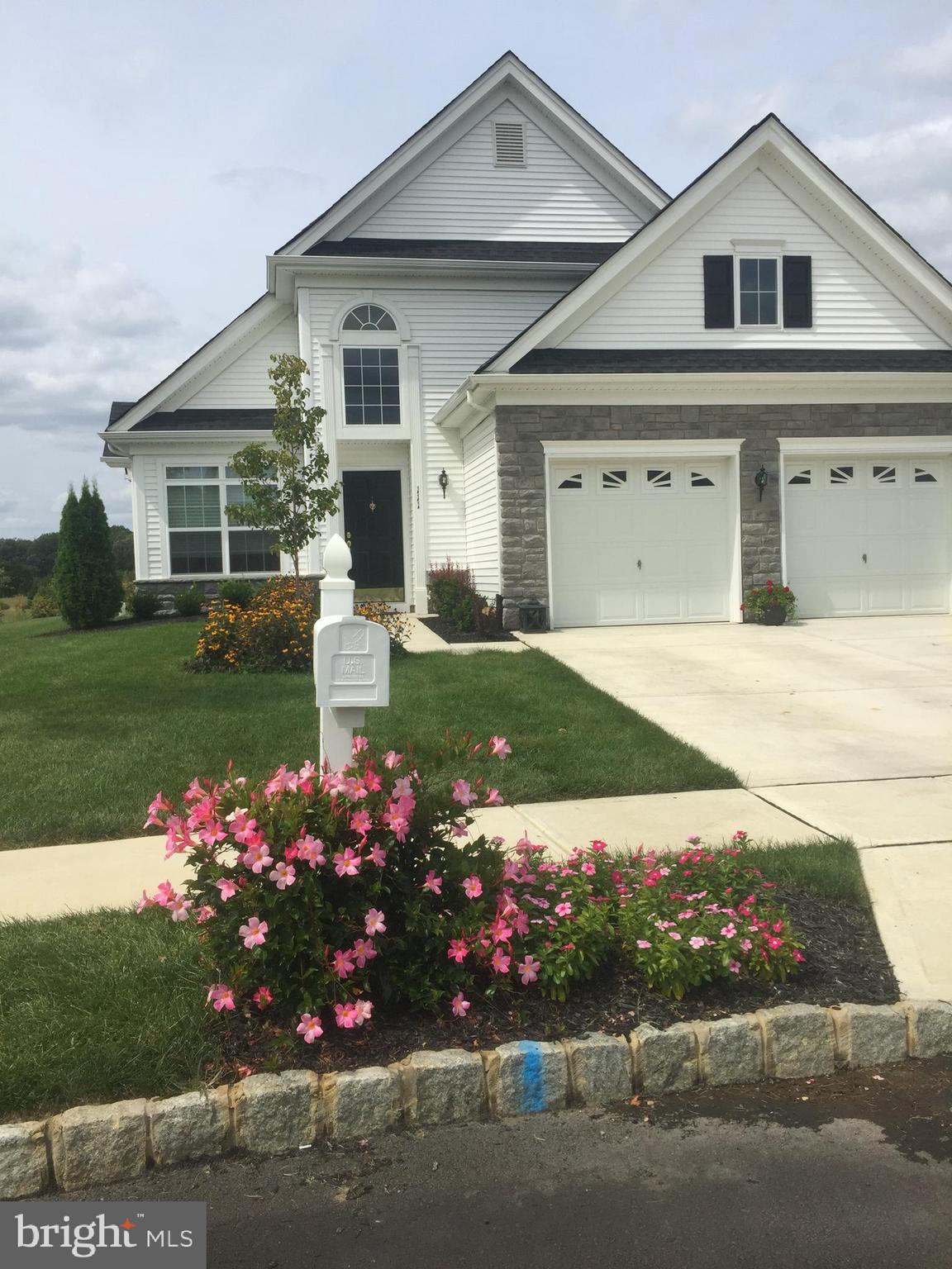 111 Weatherby Lane Glassboro, NJ 08028 - Photo 10 of 95 a front view of a house with a yard and garage