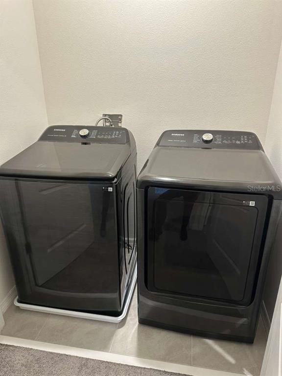 1773 Rock Elm Road Davenport, FL 33837 - Photo 15 of 23 a utility room with washing machine