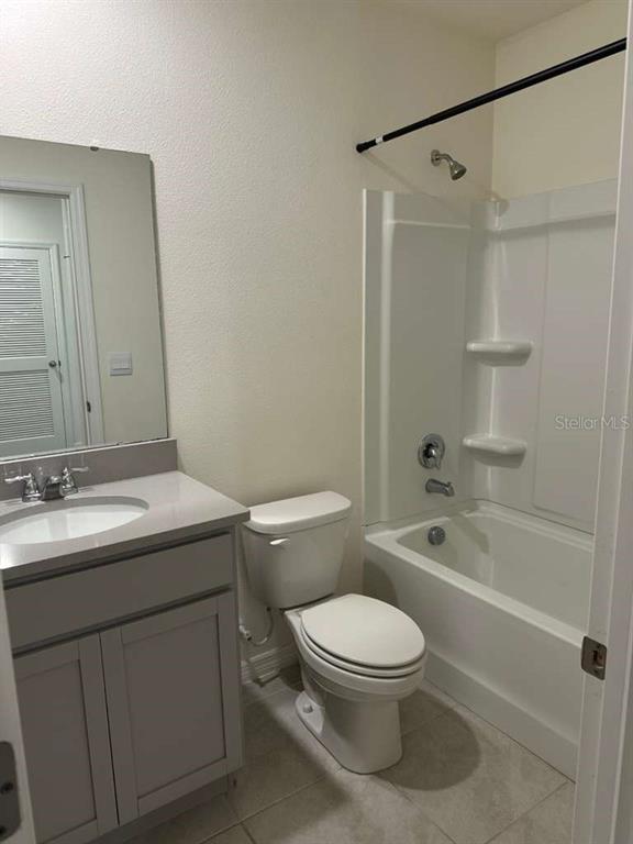 1773 Rock Elm Road Davenport, FL 33837 - Photo 3 of 23 a bathroom with a sink a toilet and shower