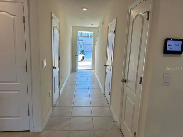 a bathroom with a shower and a glass door