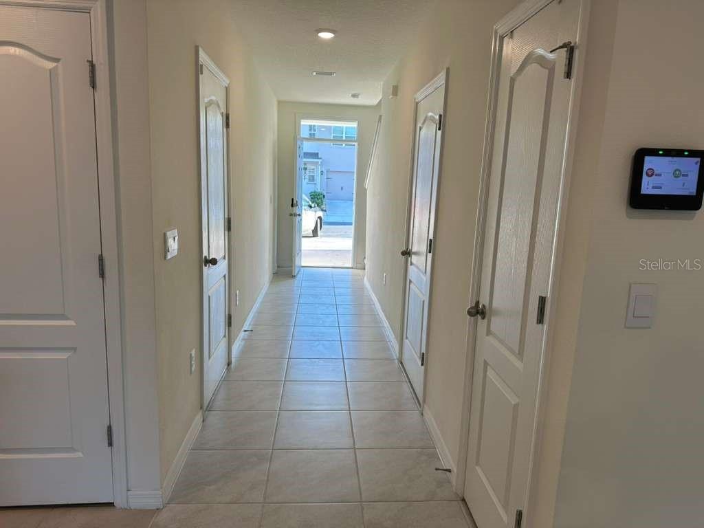1773 Rock Elm Road Davenport, FL 33837 - Photo 6 of 23 a bathroom with a shower and a glass door