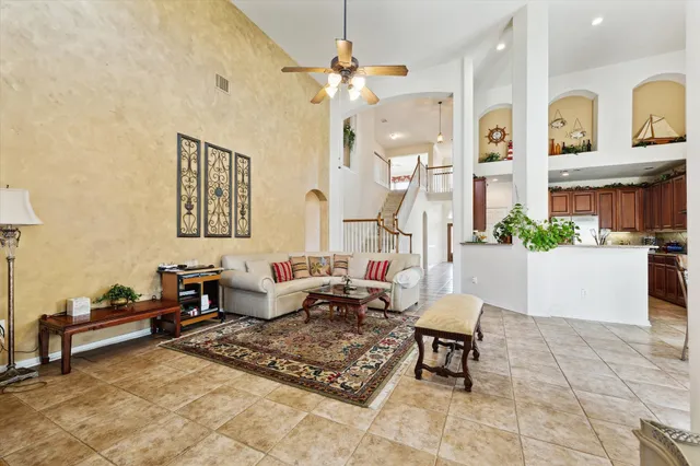 a bedroom with a bed couch and window