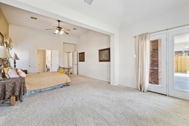 a bed room with a bed and a chandelier