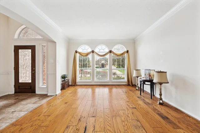 a view of a dining room with furniture and wooden floor