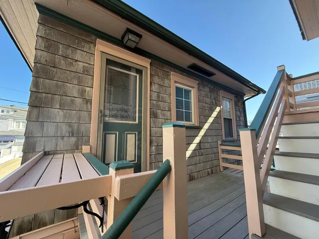 a view of deck with wooden floor and outdoor seating
