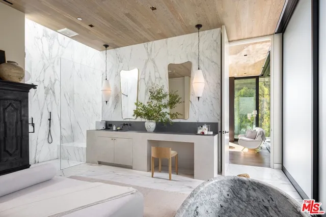 a living room with a fireplace and a chandelier