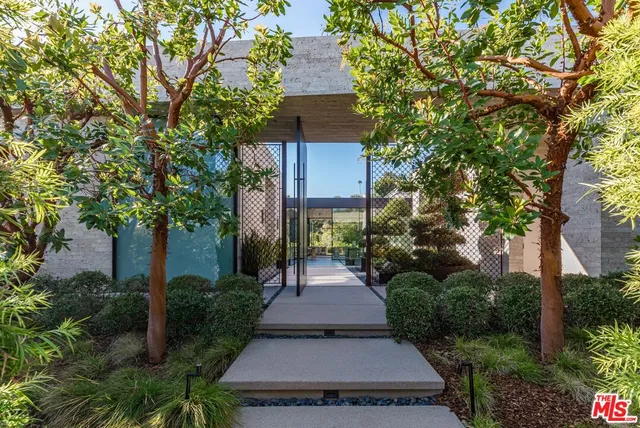 a view of a pathway with a garden