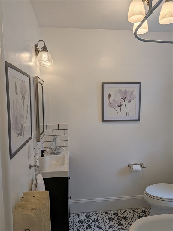 82 Gladstone Street, Unit 2 Boston, MA 02128 - Photo 13 of 23 a bathroom with a sink and a mirror