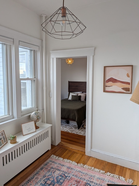 82 Gladstone Street, Unit 2 Boston, MA 02128 - Photo 17 of 23 a bedroom with furniture and a window