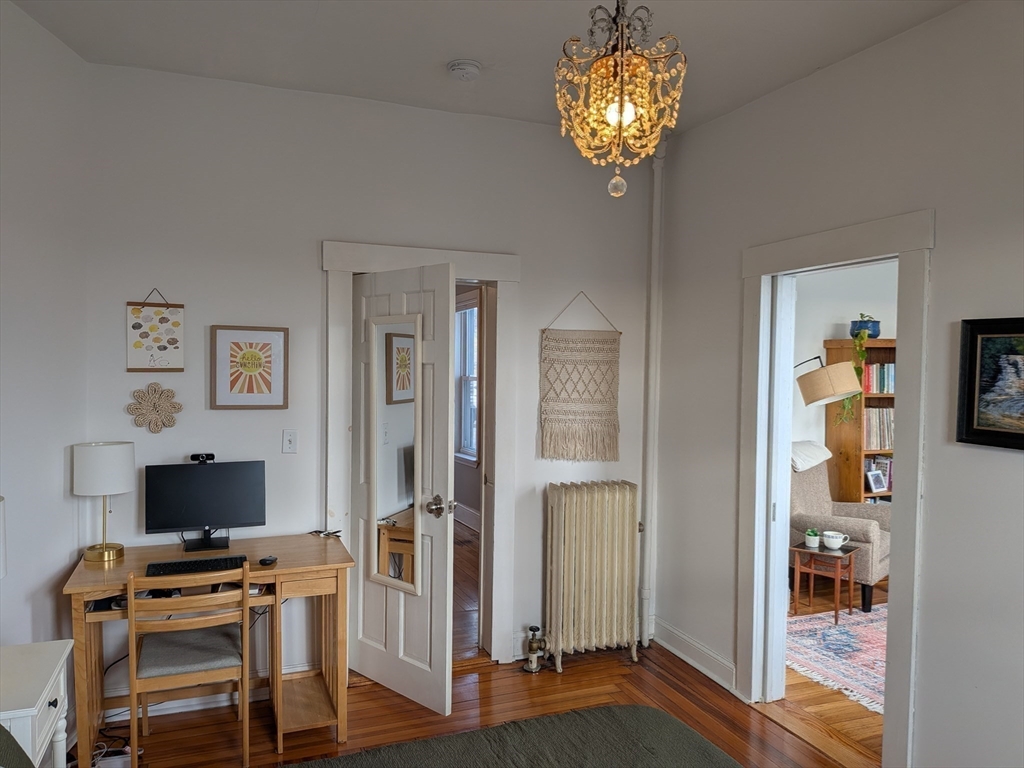 82 Gladstone Street, Unit 2 Boston, MA 02128 - Photo 19 of 23 a view of a livingroom with a chandelier