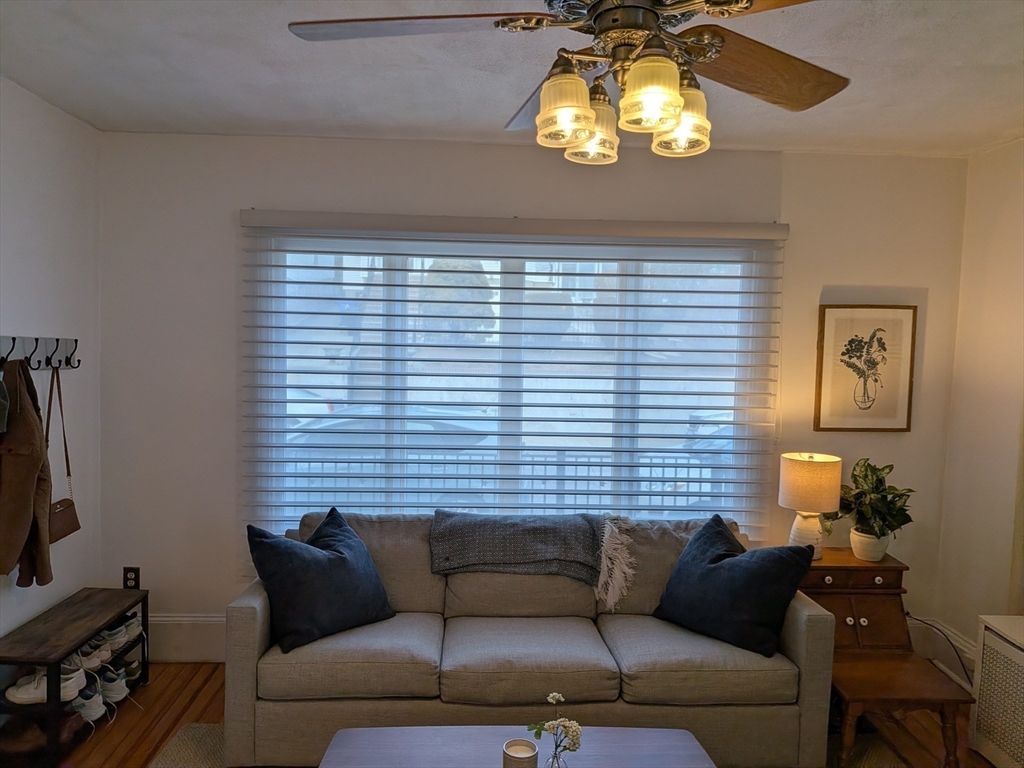82 Gladstone Street, Unit 2 Boston, MA 02128 - Photo 3 of 23 a living room with furniture and a flat screen tv