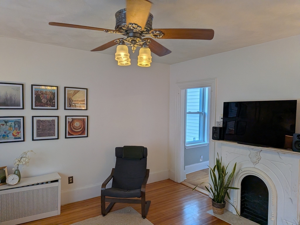 82 Gladstone Street, Unit 2 Boston, MA 02128 - Photo 4 of 23 a living room with furniture and a flat screen tv