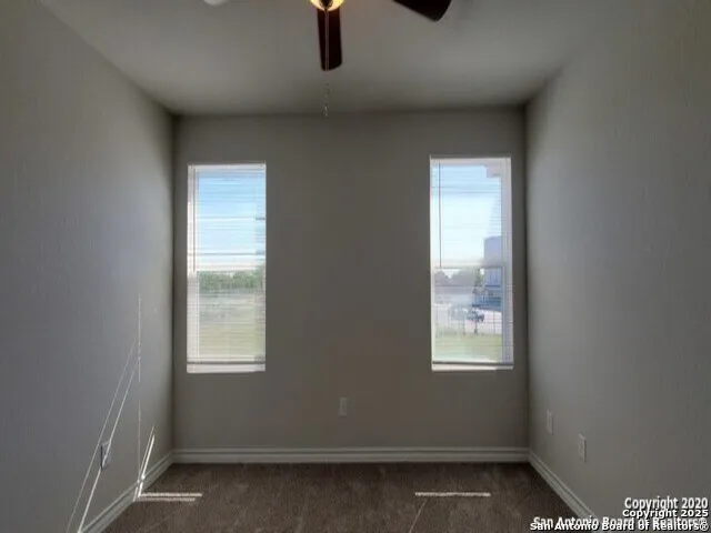 a view of an empty room with a bathroom