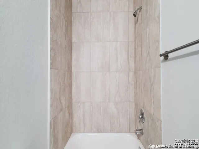 a bathroom with a sink and vanity