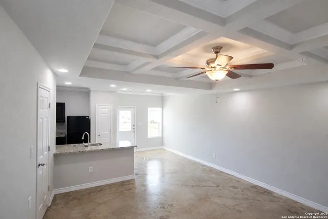 a view of an empty room with a bathroom