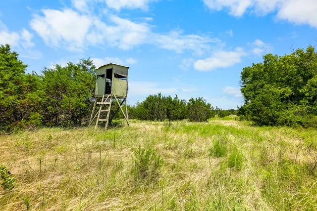 a view of lake with green space