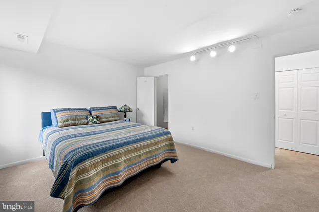 a bedroom with a bed and a cabinets