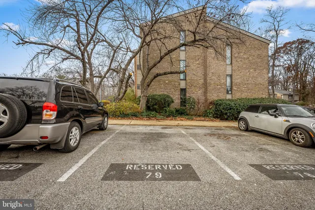 a view of a car parked in front of a house