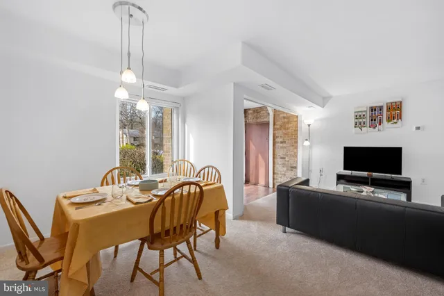 a view of a livingroom with furniture and a flat screen tv