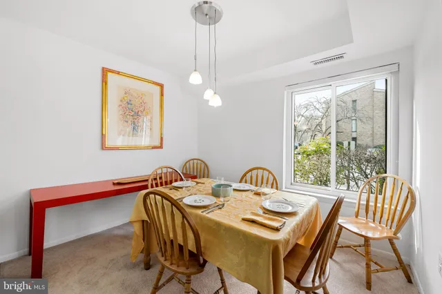 a view of a dining room with furniture window and outside view