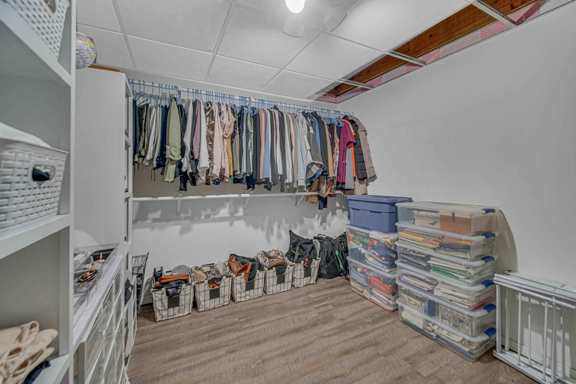 4942 West 93rd Court Crown Point, IN 46307 - Photo 27 of 37 a view of walk in closet with clothes and shoes