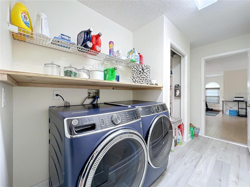 17528 East Apshawa Road Minneola, FL 34715 - Photo 15 of 22 a utility room with dryer and washer
