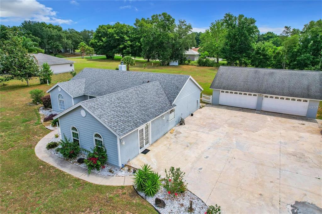 17528 East Apshawa Road Minneola, FL 34715 - Photo 22 of 22 an aerial view of a house with a yard