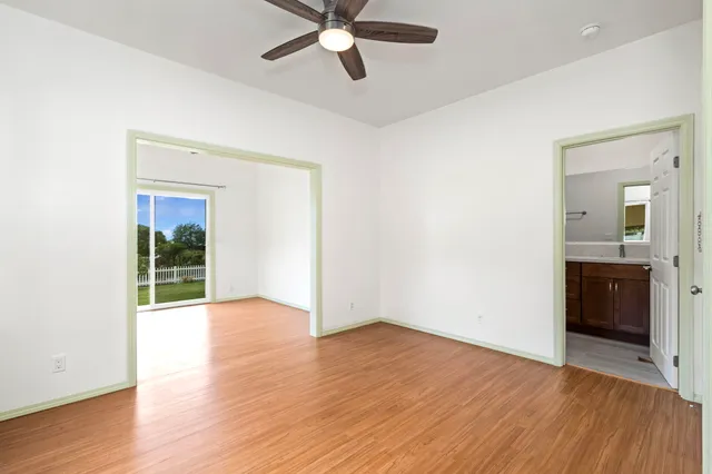 a bathroom with a granite countertop toilet sink and a mirror