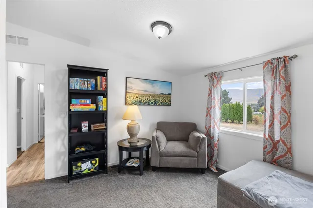 a living room with furniture and a window