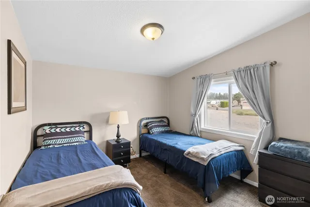 a bedroom with furniture and a window