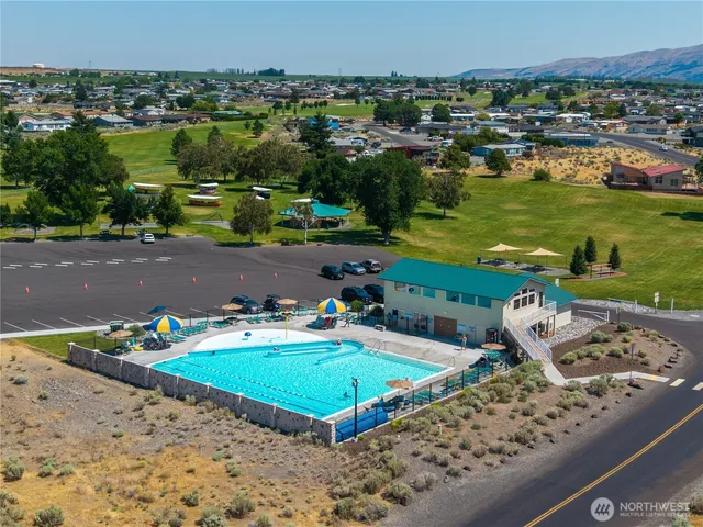 an aerial view of a house with a ocean view
