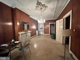 a view of a livingroom with furniture and chandelier