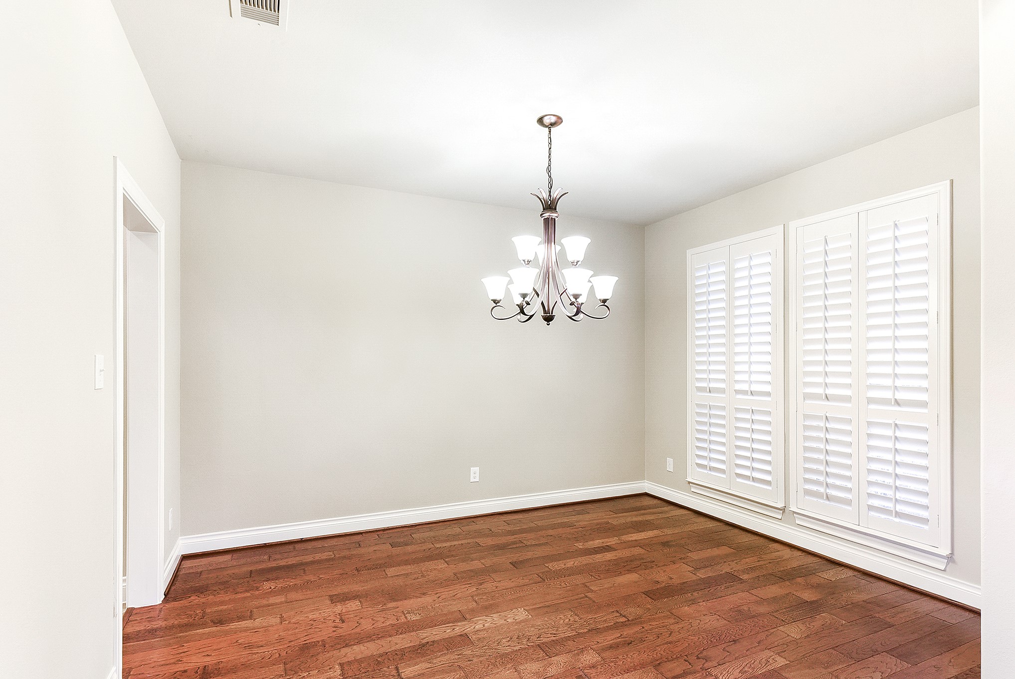 29023 Powder Ridge Drive Katy, TX 77494 - Photo 7 of 50 Another view of the formal dining room highlights its dual-entry design, providing access to both the kitchen and foyer. Directly across is the home office, featuring matching wood flooring and lovely views of the front yard.