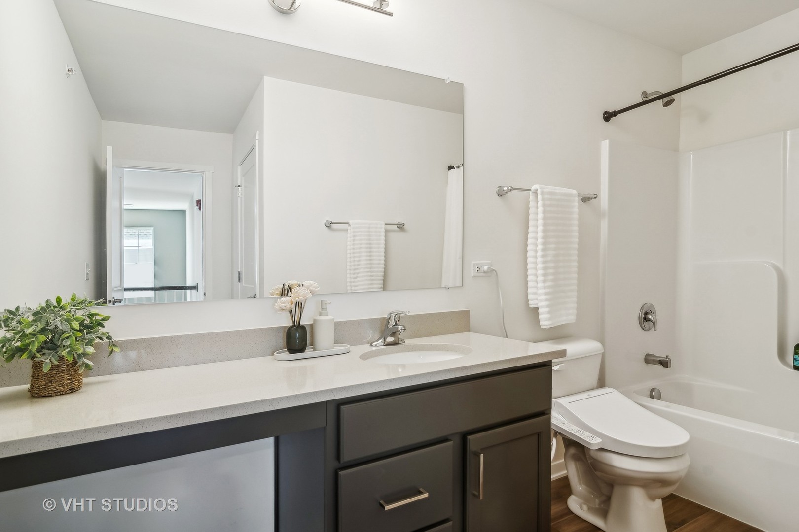 253 Hoffman Drive Buffalo Grove, IL 60089 - Photo 18 of 32 a bathroom with a sink a toilet and shower