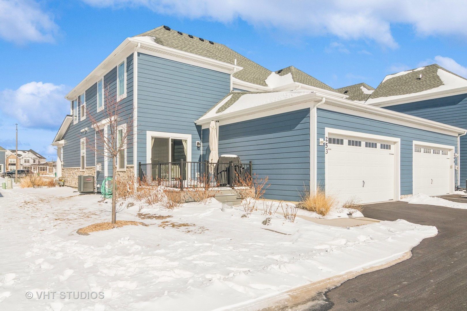 253 Hoffman Drive Buffalo Grove, IL 60089 - Photo 22 of 32 a view of a house with snow on the road