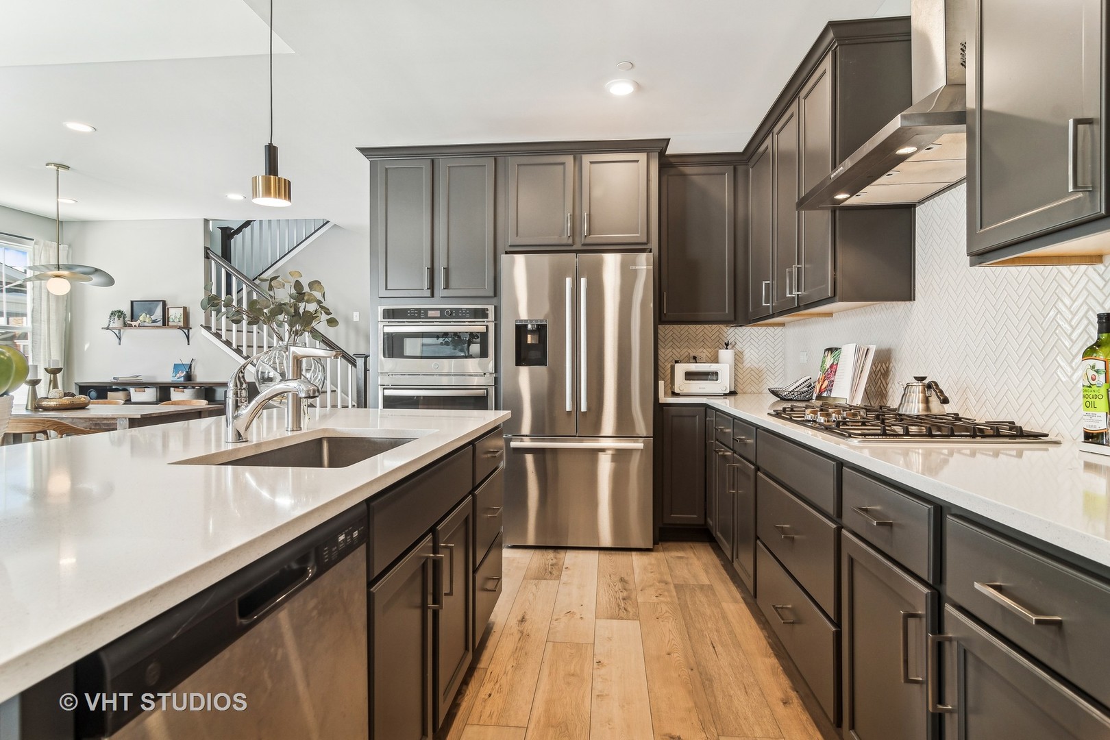 253 Hoffman Drive Buffalo Grove, IL 60089 - Photo 7 of 32 a kitchen with stainless steel appliances granite countertop a sink refrigerator and cabinets