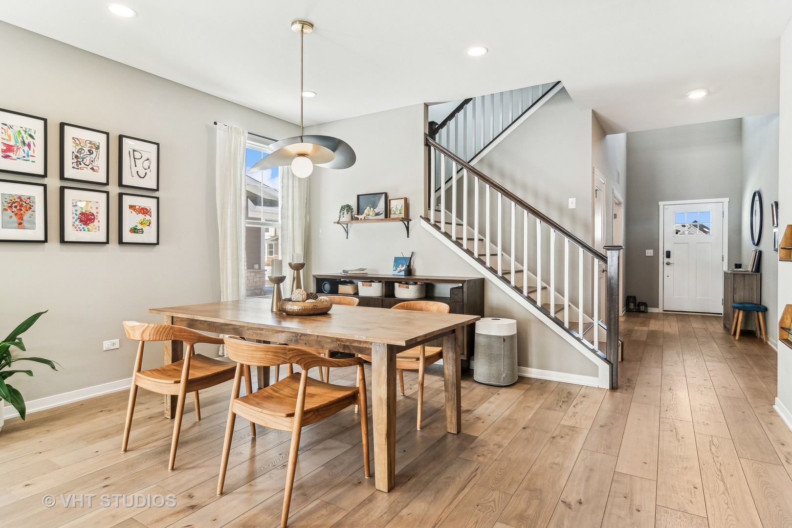 253 Hoffman Drive Buffalo Grove, IL 60089 - Photo 8 of 32 a view of a dining room with furniture window and wooden floor